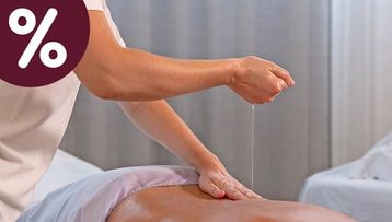 Aromaöl-Massage in der Massagelounge der Wellness-Welt sole uno für das September-Angebot Magie der Düfte mit Prozent-Icon